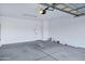 Spacious garage with a door leading inside and a garage door opener at 3640 E Torrey Pines Ln, Chandler, AZ 85249