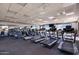 Spacious gym area with treadmills, elliptical machines, and large windows at 3640 E Torrey Pines Ln, Chandler, AZ 85249
