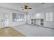Bright living area with neutral colors, carpet flooring, and built in shelving at 3640 E Torrey Pines Ln, Chandler, AZ 85249