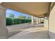 Covered patio with view of the landscaped backyard and lush greenery at 3640 E Torrey Pines Ln, Chandler, AZ 85249