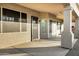 Covered patio with ample space, offering a comfortable outdoor living area with security door and plenty of shade at 3640 E Torrey Pines Ln, Chandler, AZ 85249