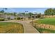 Scenic community tennis courts with lush landscaping, providing a great recreational amenity for residents at 3640 E Torrey Pines Ln, Chandler, AZ 85249