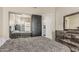This bedroom has unique wood grain furniture and a door leading into another room at 3703 S 73Rd Dr, Phoenix, AZ 85043