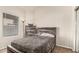 Bedroom with natural light from window and matching wood grain furniture at 3703 S 73Rd Dr, Phoenix, AZ 85043