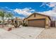 A view of the home showcasing its well-maintained yard and desert landscape with rock and gravel at 3703 S 73Rd Dr, Phoenix, AZ 85043
