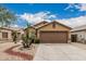 Single-story home with a two-car garage, desert landscaping, and a neutral color scheme at 3703 S 73Rd Dr, Phoenix, AZ 85043