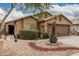 Exterior view of a home featuring low-maintenance desert landscaping and a welcoming entrance at 3703 S 73Rd Dr, Phoenix, AZ 85043