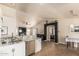 Open-concept kitchen featuring granite counters, stainless appliances, and seamless flow to the living area at 3703 S 73Rd Dr, Phoenix, AZ 85043