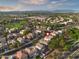 An aerial shot showcasing a home near tennis courts and a park, emphasizing nearby recreational amenities at 3773 E Stampede Dr, Gilbert, AZ 85297
