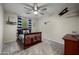Inviting bedroom features a cozy bed, decorative airplane accents, and soft natural light from the window at 3773 E Stampede Dr, Gilbert, AZ 85297