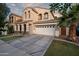 Attractive two-story home with arched windows and a large three-car garage, providing ample space and curb appeal at 3773 E Stampede Dr, Gilbert, AZ 85297