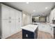 Gourmet kitchen with white cabinetry, a large island, and an open layout, perfect for entertaining at 3773 E Stampede Dr, Gilbert, AZ 85297