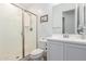 Clean bathroom featuring a glass-enclosed shower and a modern vanity with sleek fixtures at 3856 E Shannon St, Gilbert, AZ 85295
