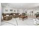 Open-concept living area featuring plush seating, a decorative rug, and seamless connection to the dining and kitchen areas at 3856 E Shannon St, Gilbert, AZ 85295