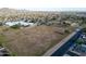 Scenic aerial view of community sports field with soccer goals, school buildings, and lush green spaces at 4033 W Sharon Ave, Phoenix, AZ 85029
