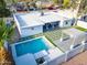 An aerial view shows this well maintained home with an appealing backyard featuring a pool and covered patio at 4033 W Sharon Ave, Phoenix, AZ 85029
