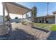 Spacious backyard with desert landscaping, a refreshing pool, and a covered patio area, perfect for relaxation at 4033 W Sharon Ave, Phoenix, AZ 85029