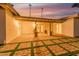 Expansive backyard with a covered patio, perfect for outdoor entertaining against a vivid sunset backdrop at 4033 W Sharon Ave, Phoenix, AZ 85029