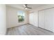 Bright bedroom featuring a large window, closet, and light gray flooring at 4033 W Sharon Ave, Phoenix, AZ 85029