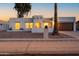 Charming exterior of a single-story home with desert landscaping, a tiled roof, and an attached two-car garage at 4033 W Sharon Ave, Phoenix, AZ 85029