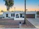 Beautiful home with a well-manicured front yard and a unique architectural style at 4033 W Sharon Ave, Phoenix, AZ 85029