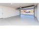 Spacious garage with an open door, offering ample parking and storage at 4033 W Sharon Ave, Phoenix, AZ 85029