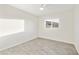 Bright bedroom featuring tile floors, a ceiling fan, and natural light at 4410 N 20Th Ave, Phoenix, AZ 85015