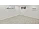 Empty room with updated floors and fresh white paint at 4410 N 20Th Ave, Phoenix, AZ 85015