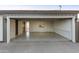 Spacious garage with an open door revealing a bright interior, a side door, and outdoor lighting at 4410 N 20Th Ave, Phoenix, AZ 85015