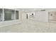 Open-concept living space showcasing kitchen pass-through, neutral paint, recessed lighting, and tile floors at 4410 N 20Th Ave, Phoenix, AZ 85015