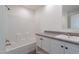Bathroom featuring a shower/tub combo, white cabinets and a gray counter at 46 S 96Th St, Mesa, AZ 85208