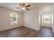 This bedroom has a ceiling fan and a window that provides natural light at 46 S 96Th St, Mesa, AZ 85208