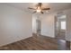 The bedroom features a ceiling fan and doorways that allow access to other rooms at 46 S 96Th St, Mesa, AZ 85208