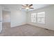 Neutral bedroom with neutral walls, carpet and a ceiling fan at 46 S 96Th St, Mesa, AZ 85208