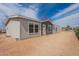 Well-maintained home featuring a light gray exterior, complemented by a spacious yard and welcoming front entrance at 46 S 96Th St, Mesa, AZ 85208