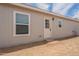 This property features a clean, bright exterior with a classic white door and well-placed windows for ample natural light at 46 S 96Th St, Mesa, AZ 85208