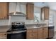 Modern kitchen with stainless steel appliances and wood cabinets at 46 S 96Th St, Mesa, AZ 85208