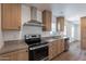 This modern kitchen features stainless steel appliances and wooden cabinets at 46 S 96Th St, Mesa, AZ 85208