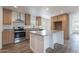 Modern kitchen with stainless steel appliances, a central island, and ample counter space at 46 S 96Th St, Mesa, AZ 85208