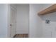 Practical laundry area features a wooden shelf and access for a washing machine hook-up at 46 S 96Th St, Mesa, AZ 85208