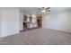Expansive living room transitioning to the kitchen with ample space, ceiling fan, and a welcoming atmosphere at 46 S 96Th St, Mesa, AZ 85208