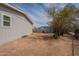 The side yard showing gravel landscaping and a partial view of the fence line at 46 S 96Th St, Mesa, AZ 85208