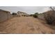 Expansive backyard with desert landscaping, block wall fence, providing a blank canvas for outdoor living at 4804 S 25Th Dr, Phoenix, AZ 85041