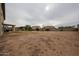 Large backyard featuring desert landscaping, partial grass area and block wall fence with ample space at 4804 S 25Th Dr, Phoenix, AZ 85041