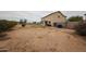 Expansive backyard featuring desert landscaping, a small patch of grass, and a block wall fence for added privacy at 4804 S 25Th Dr, Phoenix, AZ 85041