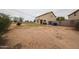 Spacious backyard with desert landscaping, small grassy area, and a block wall providing privacy at 4804 S 25Th Dr, Phoenix, AZ 85041