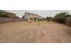 Large backyard with desert landscaping, block wall fence, offering ample space and privacy at 4804 S 25Th Dr, Phoenix, AZ 85041