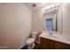 Well-lit powder bathroom with vanity and ample counter space at 4804 S 25Th Dr, Phoenix, AZ 85041