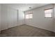 Bedroom featuring a ceiling fan, windows for natural light, and a sliding closet at 4804 S 25Th Dr, Phoenix, AZ 85041
