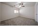 Bedroom with neutral carpet, ceiling fan, and a window allowing natural light at 4804 S 25Th Dr, Phoenix, AZ 85041